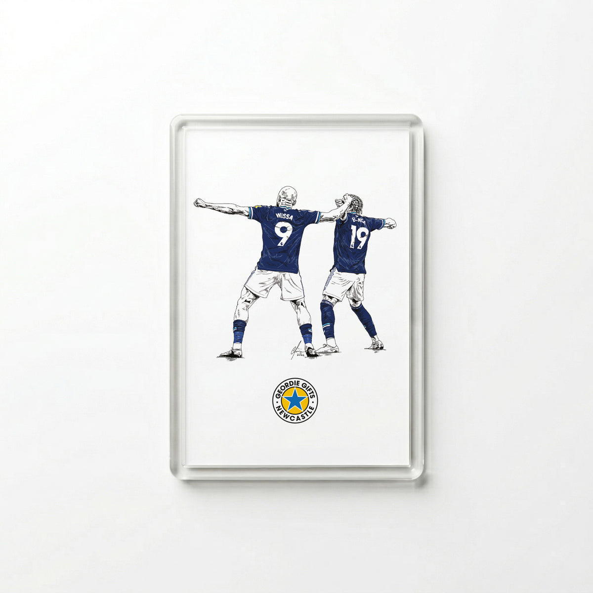 Clear acrylic Yoane Wissa and Anthony Elanga Newcastle United goal celebration fridge magnet by Geordie Gifts on a white background.