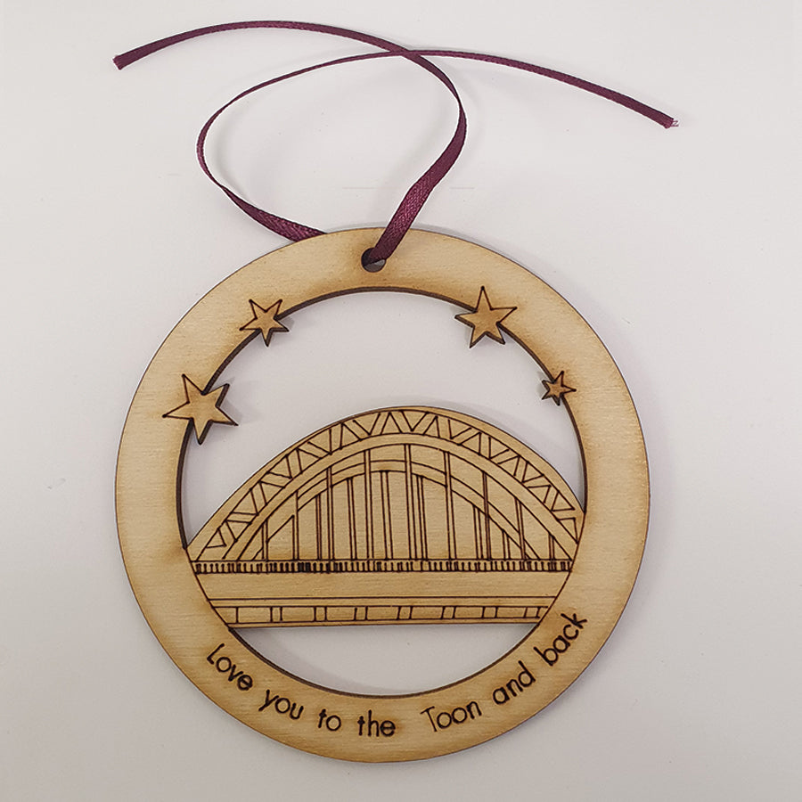 Unique High Quality Lazer Cut Geordie Christmas Tree Decoration Baubles  Bauble displays: Etched illustration of the Tyne Bridge alongside the text 'Love you to the Toon and back'. by geordie gifts and craft sensations