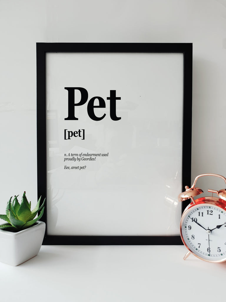 Pet Geordie word print in a black frame, showcasing the definition and cultural meaning of 'Pet' as a term of endearment in Newcastle dialect. Ideal for Geordie homes or as a unique gift, this artwork brings the warmth of Newcastle into any space. Available from Geordie Gifts in the historic Grainger Market