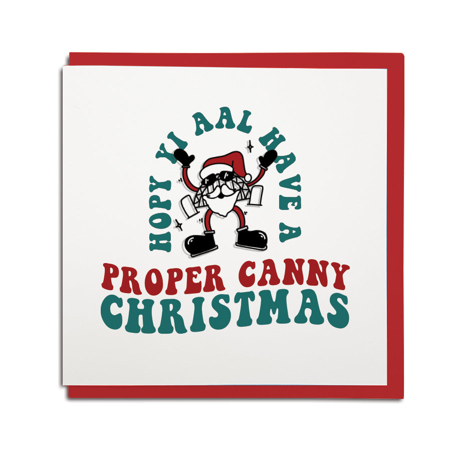 Funny Geordie Christmas card by Geordie Gifts featuring Santa as the Tyne Bridge with the text "Proper Canny Christmas."