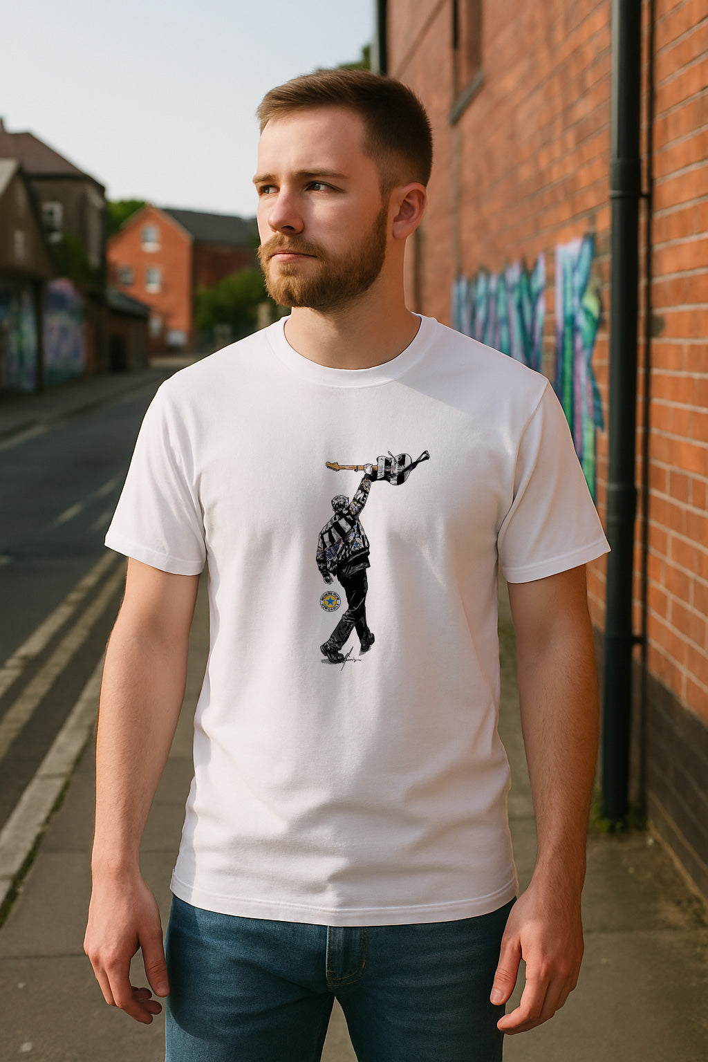 Man wearing Sam Fender St James’ Park 2025 illustration T-shirt by Geordie Gifts, standing on a Newcastle street with urban graffiti backdrop.