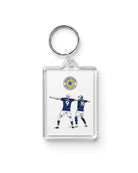 Clear acrylic Yoane Wissa and Anthony Elanga Newcastle United goal celebration keyring by Geordie Gifts on a plain white background.