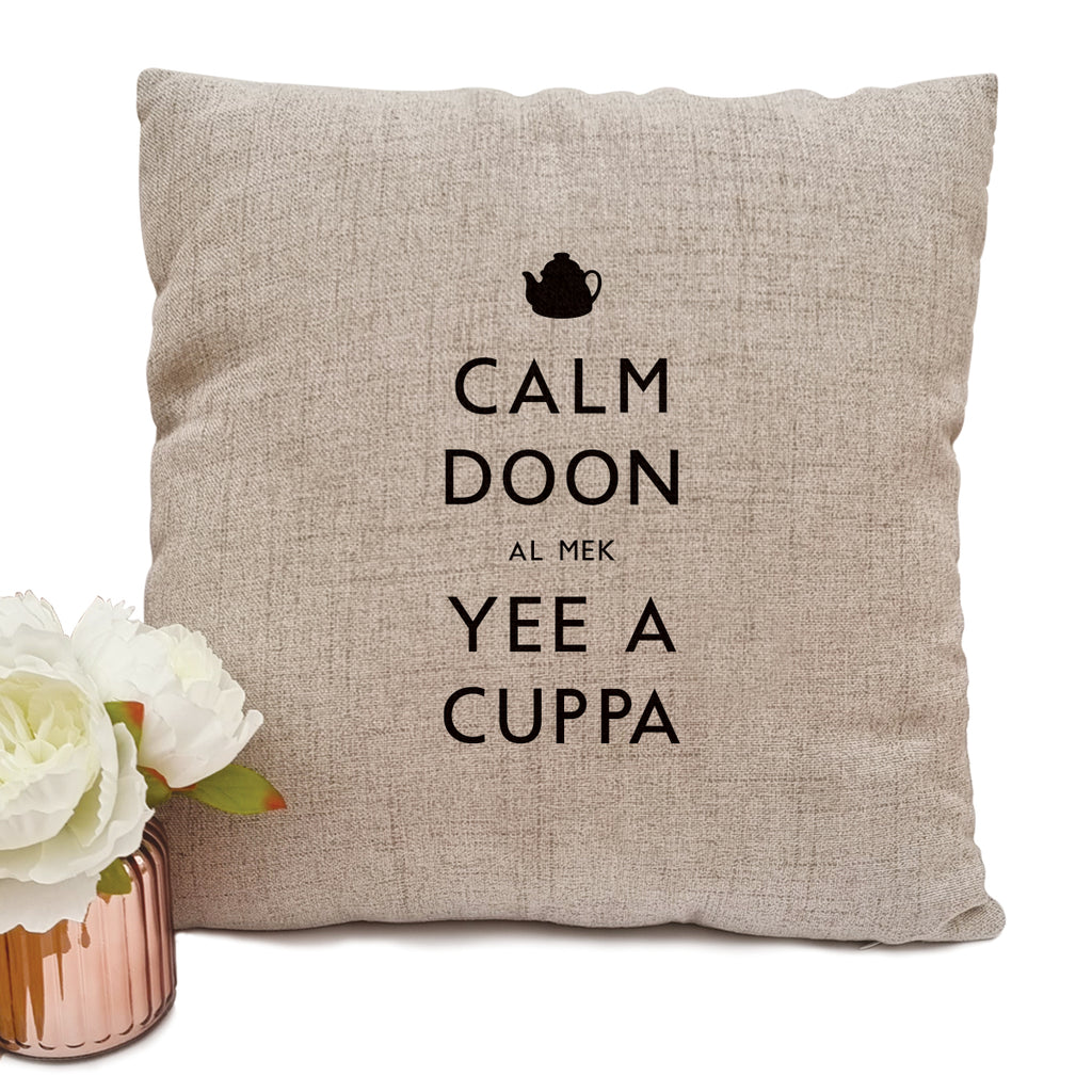 Geordie cushion cover which reads calm doon al mek yee a cuppa based on the keep calm & carry on poster. Newcastle gift shop inside the grainger market