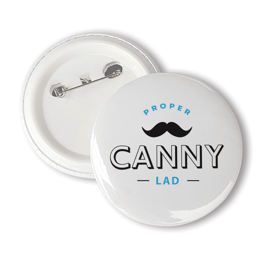 A unique 58mm badge designed & made in Newcastle by Geordie Gifts.  Badge reads: proper canny lad - Newcastle. NORTH EAST SOUVENIRS AND MERCHANDISE PIN BADGES