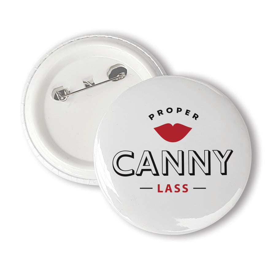 A unique 58mm badge designed & made in Newcastle by Geordie Gifts.  Badge reads: proper canny lass - Newcastle. NORTH EAST SOUVENIRS AND MERCHANDISE PIN BADGES