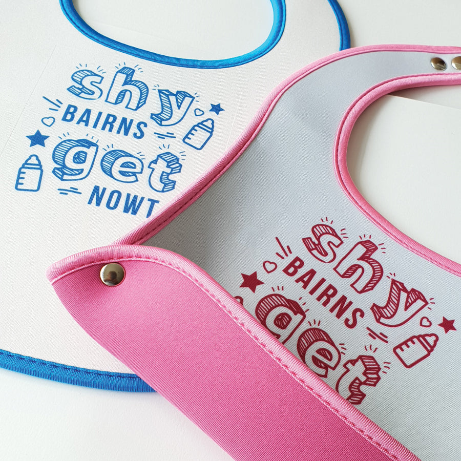 shy bairns get nowt geordie baby bib pink and blue matching with food & crumb catchers. easy wipe newcastle gifts